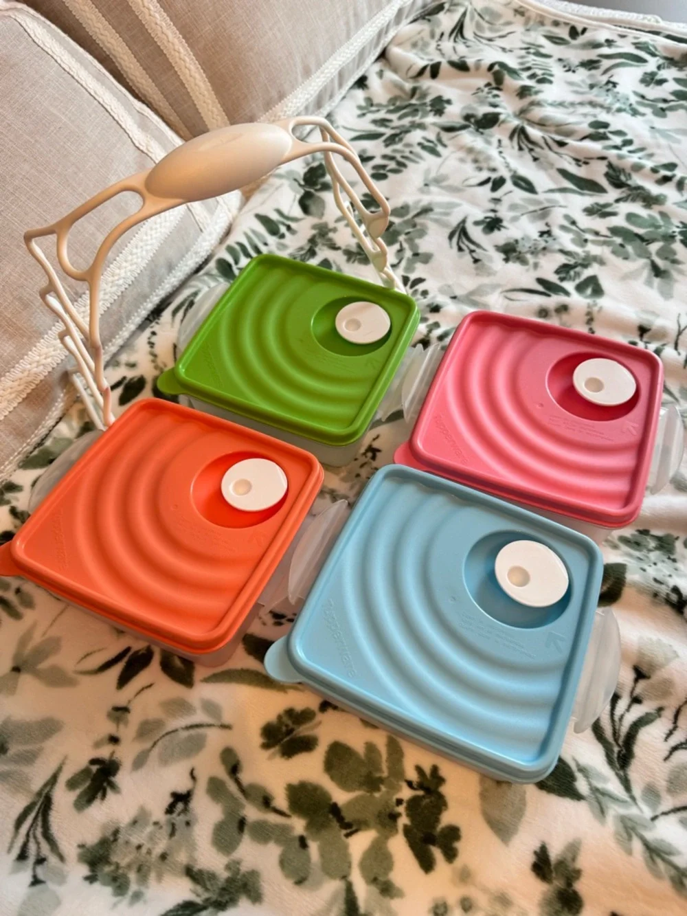 Tupperware Stacked food storage containers with carrier handle